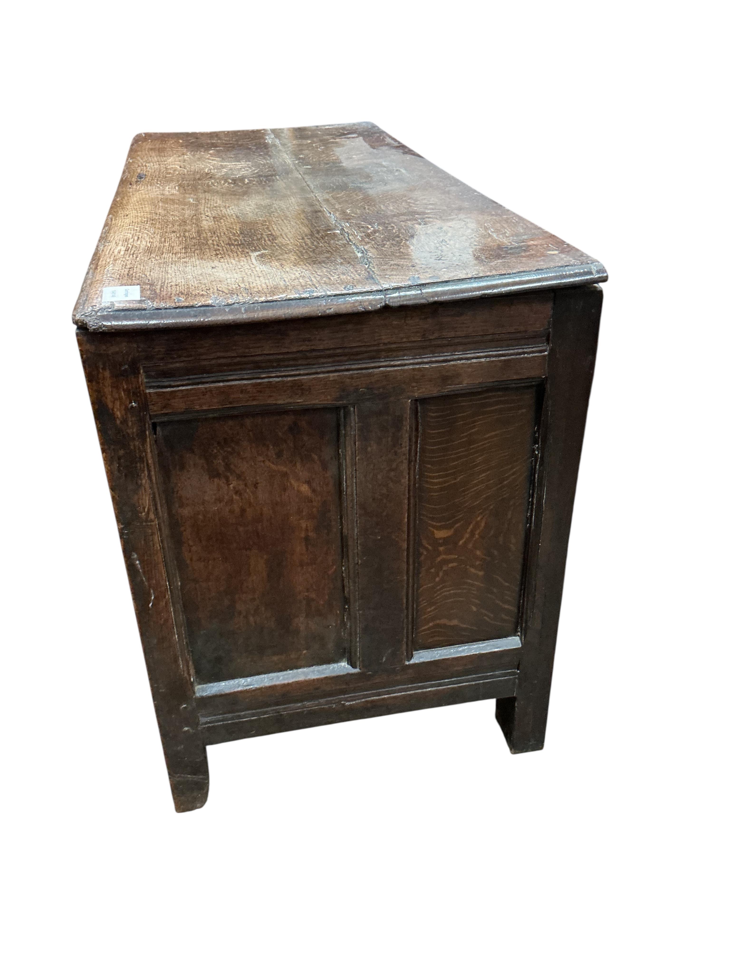 An 18th century panelled oak coffer, width 111cm, depth 48cm, height 65cm